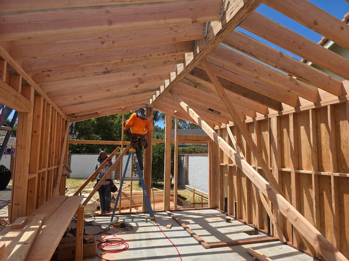 Roof rafters being framed on a new ADU in Orange, California, with the crew working on site, August 2026