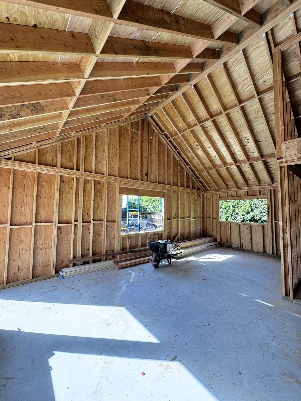 Roof and wall framing of a 700 sq ft detached ADU in Pasadena, with rafters following the roof pitch to form the vaulted ceiling